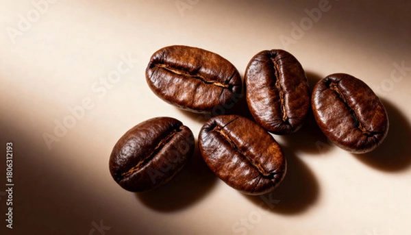 Fototapeta Coffee beans on a beige background. Close up.