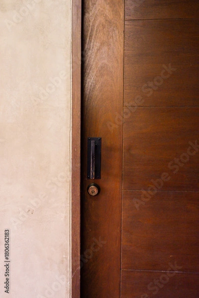 Obraz Closeup of wooden door with classic golden handles and ornaments,gold door handle and lock,Beautiful entrance to an expensive home or Luxury hotel,Copy space.