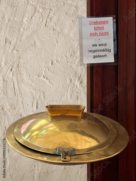 Fototapeta Opferstock in einer Kirche