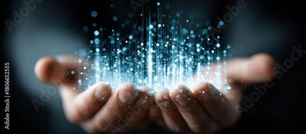 Obraz Glowing particles emanating from cupped hands, dark background