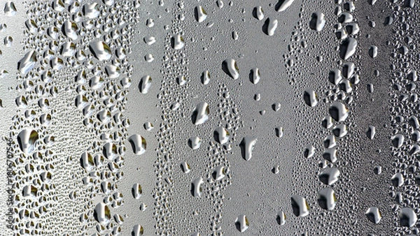 Fototapeta background, drops of morning dew, condensation on the glass. wet glass. water drops close-up. beautiful background for text. Spray cool condensate water on the glas. unusual, abstract. macro photo