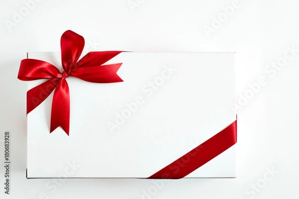 Fototapeta Red ribbon bow on white background.