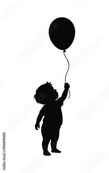 Fototapeta Silhouette of a child holding a balloon reaching for the sky