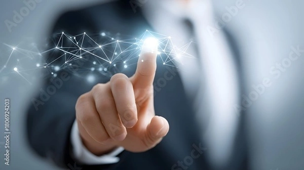 Fototapeta Close up of a person in a suit interacting with a luminous abstract network of nodes and lines representing technological advancement data flow and future possibilities in business and science