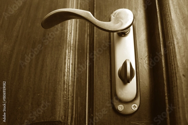 Obraz Close-up of an iron door handle on wooden door