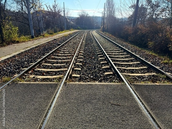 Fototapeta People and automobile asphalt crossing over rails