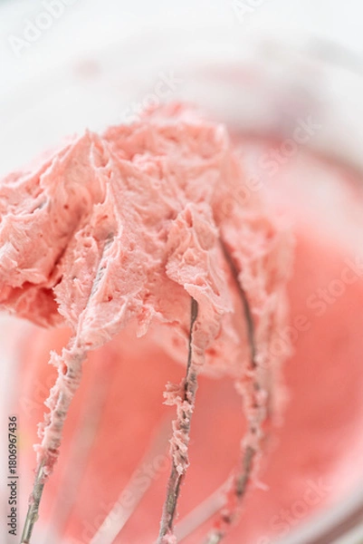 Fototapeta Pink Raspberry Buttercream on Whisk Closeup
