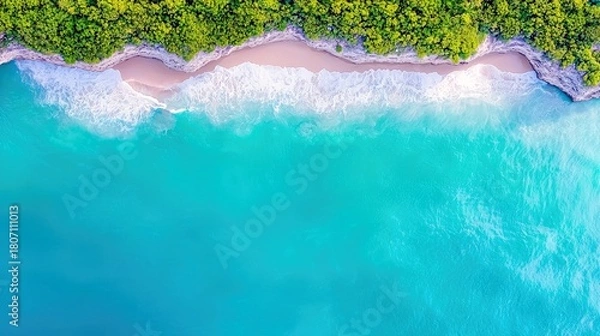Fototapeta An aerial view showcases a secluded tropical beach with vibrant turquoise waters, gentle white waves lapping the shore, and dense green foliage atop rocky cliff