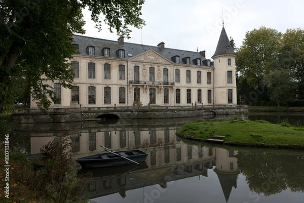 Fototapeta France's Chantilly Castle on a cloudy summer day