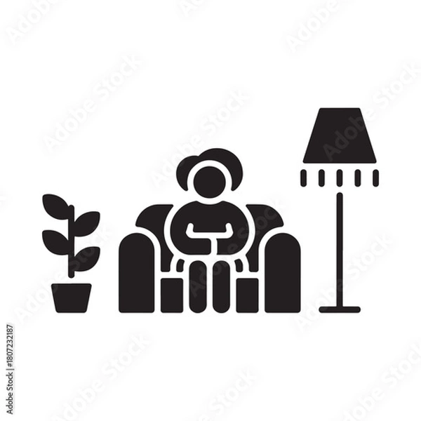 Fototapeta Person relaxing in armchair with plant and floor lamp