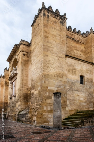 Obraz Exterior walls of the cathedral Mezquita-Catedral de Cordoba (Mosque-Cathedral of Cordoba) with carved windows and doors from the Moorish period