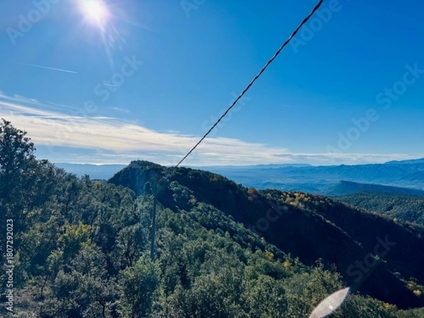 Obraz  Bright sun shining on panoramic mountain landscape view from Rocacorba
