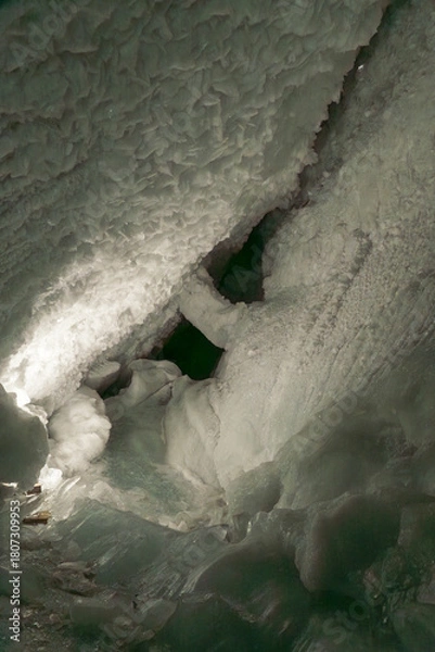 Fototapeta Ice tunnel inside the Matterhorn Glacier Paradise, Zermatt, showcasing deep blue glacial ice and shimmering alpine interiors.