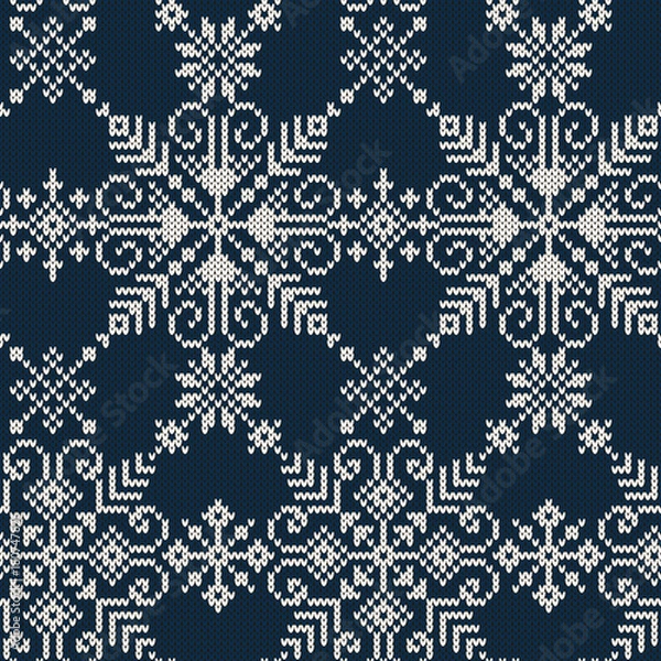 Fototapeta Seamless knitted pattern of white snowflakes on a blue background