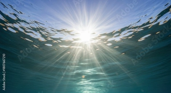 Obraz Sunlight penetrating deep blue ocean water with rippling surface above
