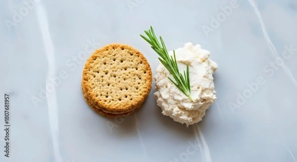 Fototapeta Organic oat crackers topped with almond cheese for healthy vegan snack and mindful eating inspiration