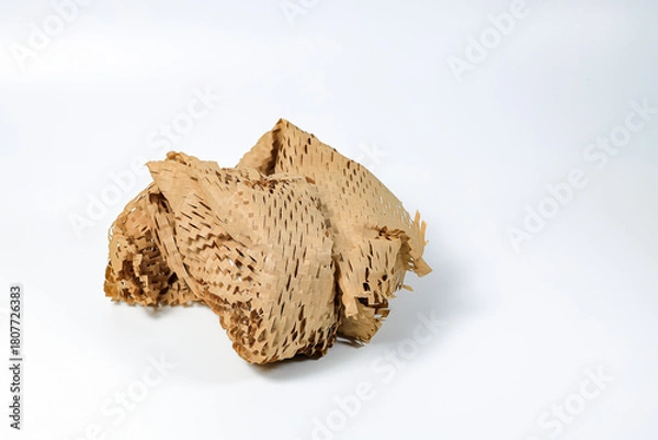 Fototapeta Parcel wrapped in eco-friendly wrapping paper, lightweight bubble wrap for protective packaging, Environmentally friendly Honeycomb paper hexagonal shape made of cardboard recycled craft paper.