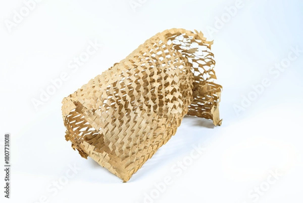 Fototapeta roll of eco-friendly wrapping paper, lightweight bubble wrap for protective packaging, Environmentally friendly Honeycomb paper hexagonal shape made of cardboard recycled craft paper.