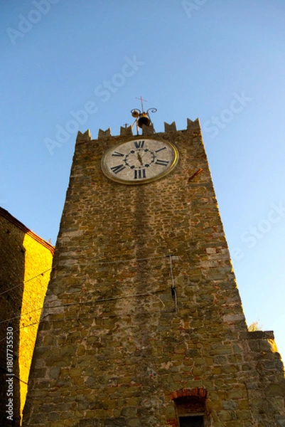 Obraz Ancient Clock Tower in Tuscany with Sunlit Stone Walls