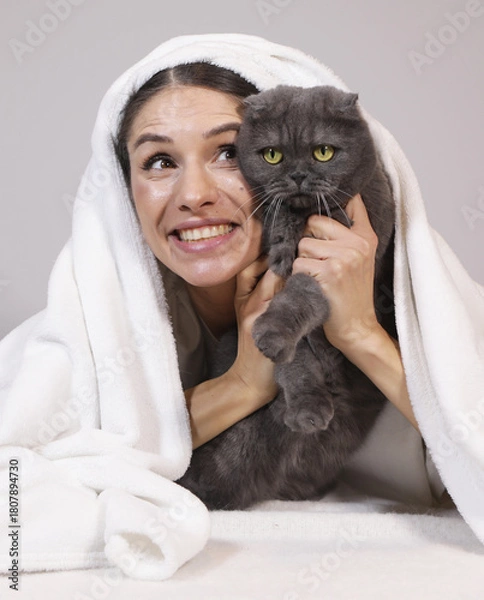 Obraz Portrait of a cat with a girl. Happy day. Cat. Family. Photo. Home concept
