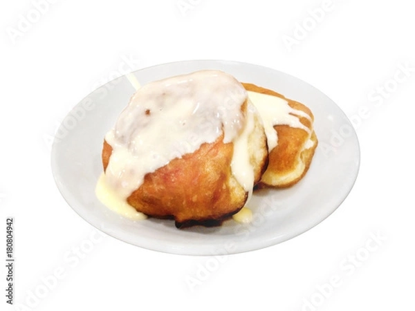 Obraz Fritters With Condensed Milk On Plate. Isolated On White.