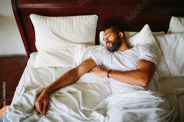 Obraz Black man sleeping in bed