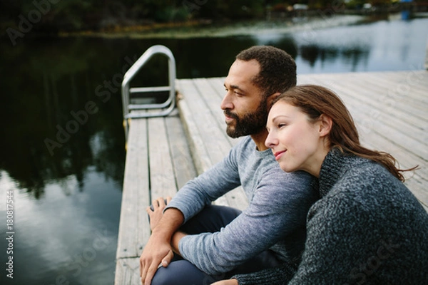 Obraz Black and white couple cuddling at the lake