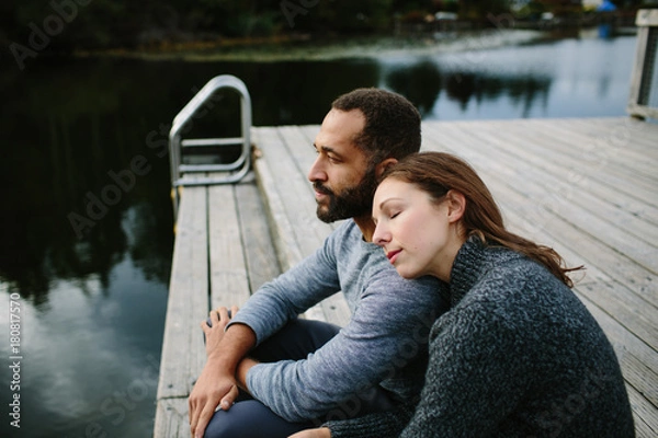 Obraz Black and white couple cuddling at the lake