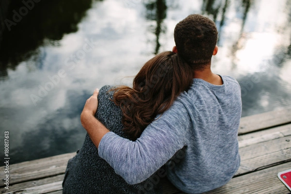 Obraz Black and white couple cuddling at the lake
