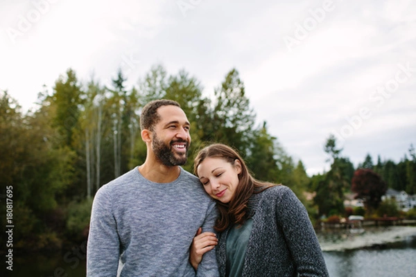 Obraz Black and white couple cuddling at the lake