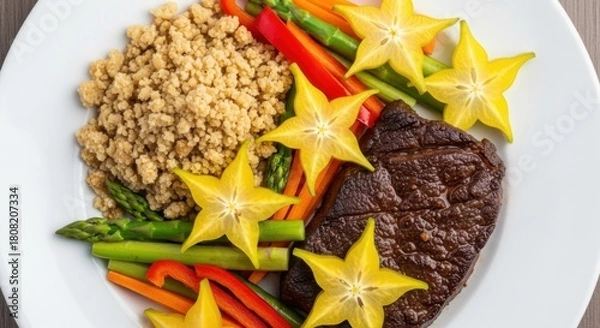 Fototapeta Grilled steak with star fruit asparagus and quinoa a healthy and colorful dish served on a white plate