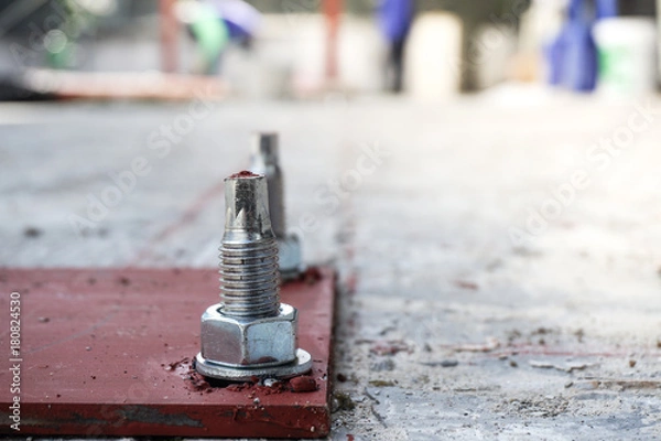 Obraz Close up of Steel base plate for steel poll with anchor bolt.
