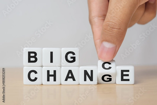 Obraz Hand flipping dice for big " Change" to big " Chance " wording. Economy investment business crisis and technology transformation can make good chance