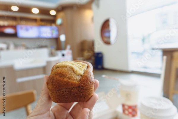 Fototapeta Delicious homemade mini banana cake and fresh pastry served on a white plate with a cup of coffee for a sweet gourmet breakfast meal 