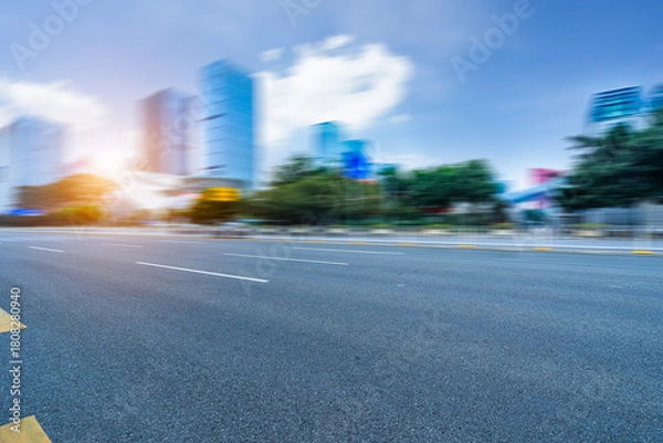 Fototapeta empty asphalt road with city skyline background in china.
