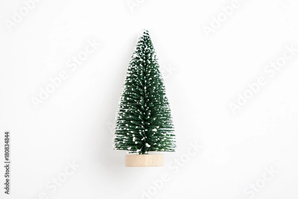 Fototapeta Small green christmas tree on a white background, top view