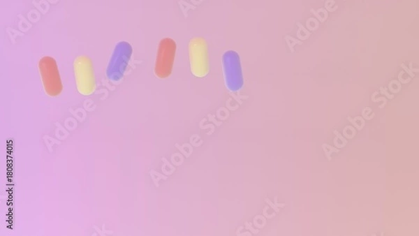Obraz Soft pastel capsules arranged in a loose arc over a smooth pink gradient background