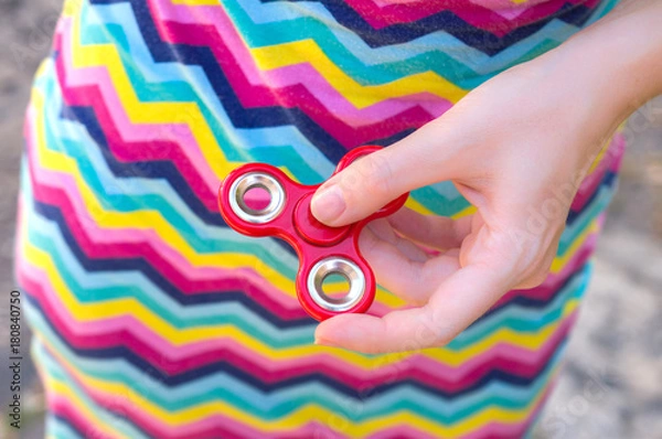Obraz spinner in woman's hand