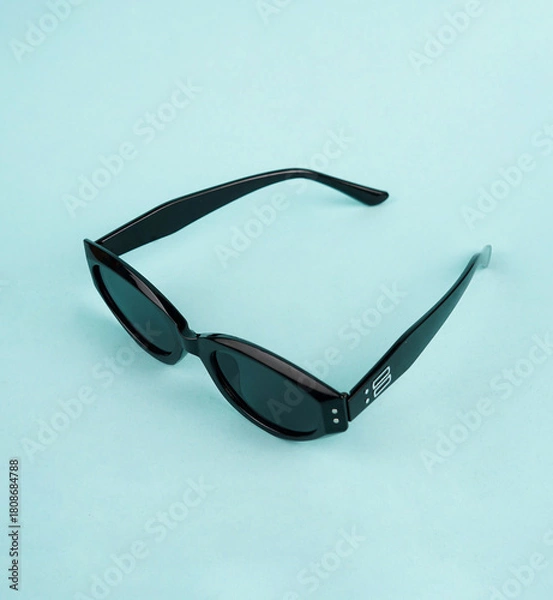 Fototapeta The glasses are placed on a light blue background, creating a calm and refreshing look
