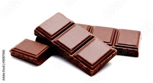 Fototapeta Dark milk chocolate bars stack isolated on a white