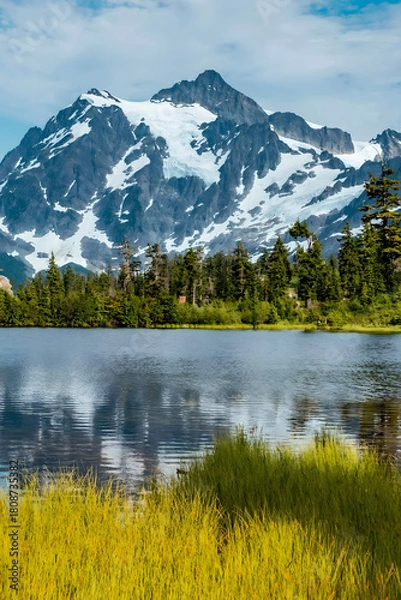 Obraz Majestic Snowcapped Mountain Peak Reflected in Pristine Alpine Lake