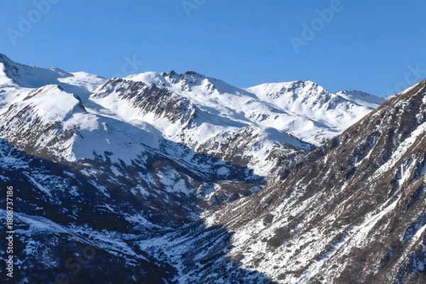 Obraz Majestic Snow-Capped Alpine Peaks and Winter Valley Under Clear Blue Sky