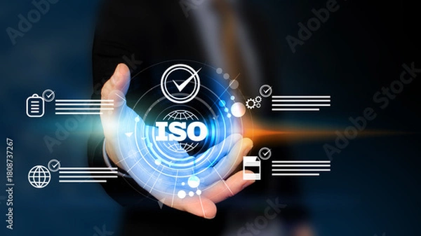 Fototapeta Businessman holding Quality assurance icon on digital screen with check mark icon for ISO certification and standardization. Quality assurance concept.