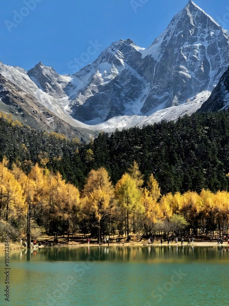 Obraz Majestic Snowcapped Peaks with Golden Autumn Forest and Turquoise Lake