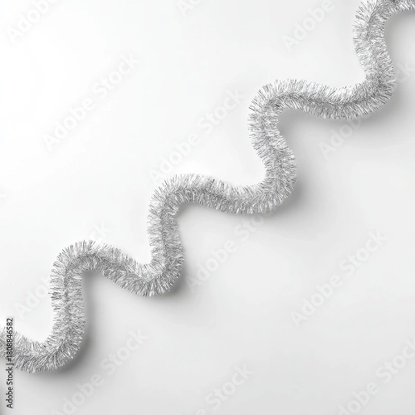 Obraz Elegant shiny silver garland in soft loops on a minimalist white background, perfect for holiday decor and festive celebrations