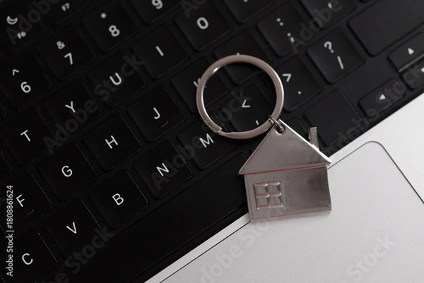 Fototapeta Home key on laptop keyboard. Online internet property search concept