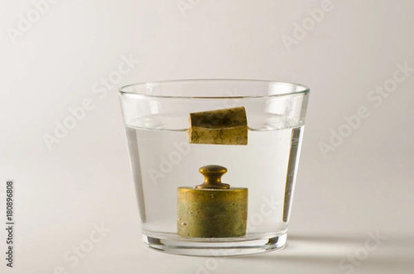 Obraz Physics. Heavy and light objects in water.