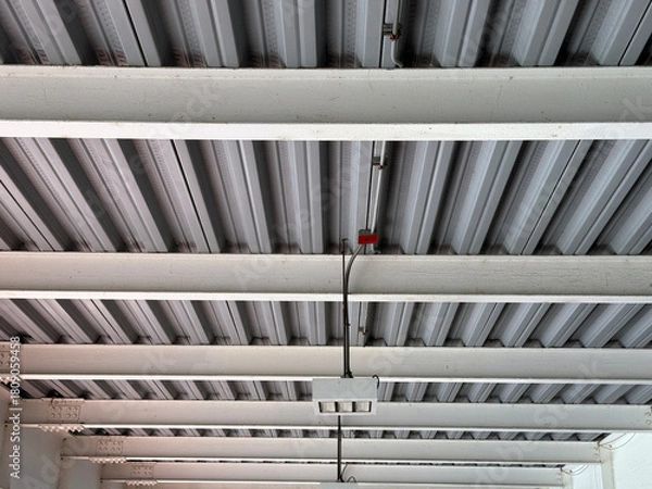 Obraz Industrial metal ceiling with beams and electrical wiring