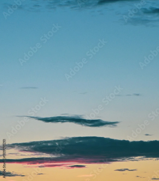 Fototapeta Radiant twilight sky illuminated by colorful clouds in a dramatic sunset