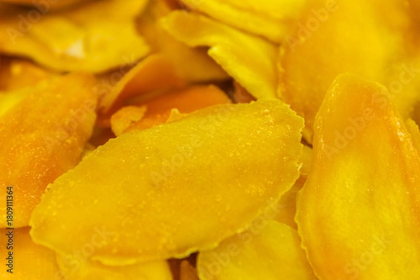 Obraz Dried mango in abundance. Top view, close-up, flat pack. Healthy eating and minimalism, dehydrated product